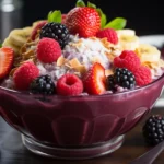 A vibrant, realistic photograph of a tropical smoothie acai bowl, styled on a bright white surface with natural sunlight