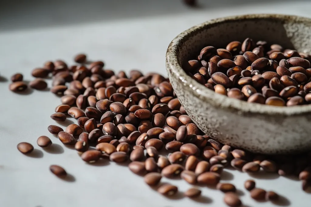 The close-up shot of raw lupin beans scattered on a countertop.