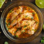 vibrant and close-up shot of raw chicken strips marinating